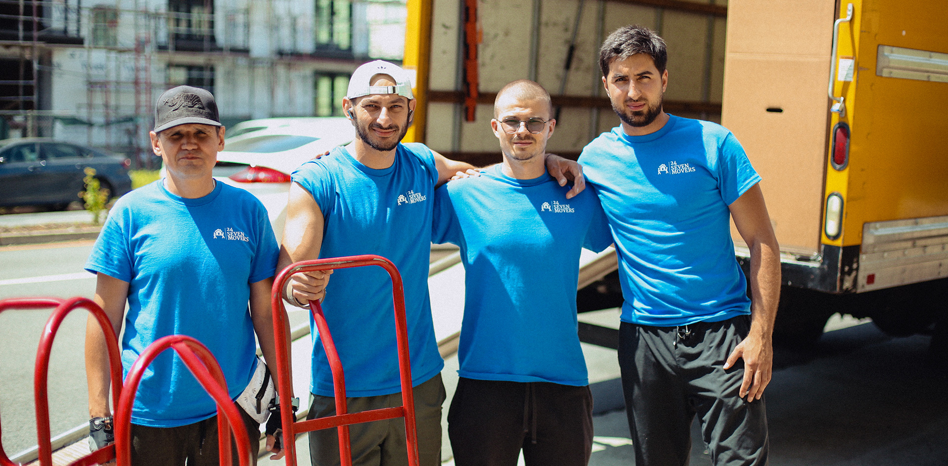 24 Seven Movers team in front of moving truck