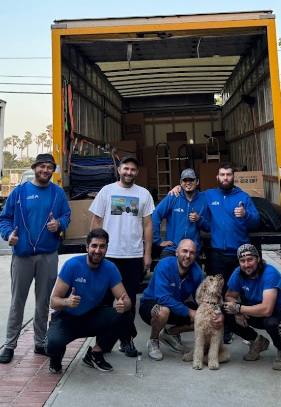 24Seven Movers team in front of moving truck